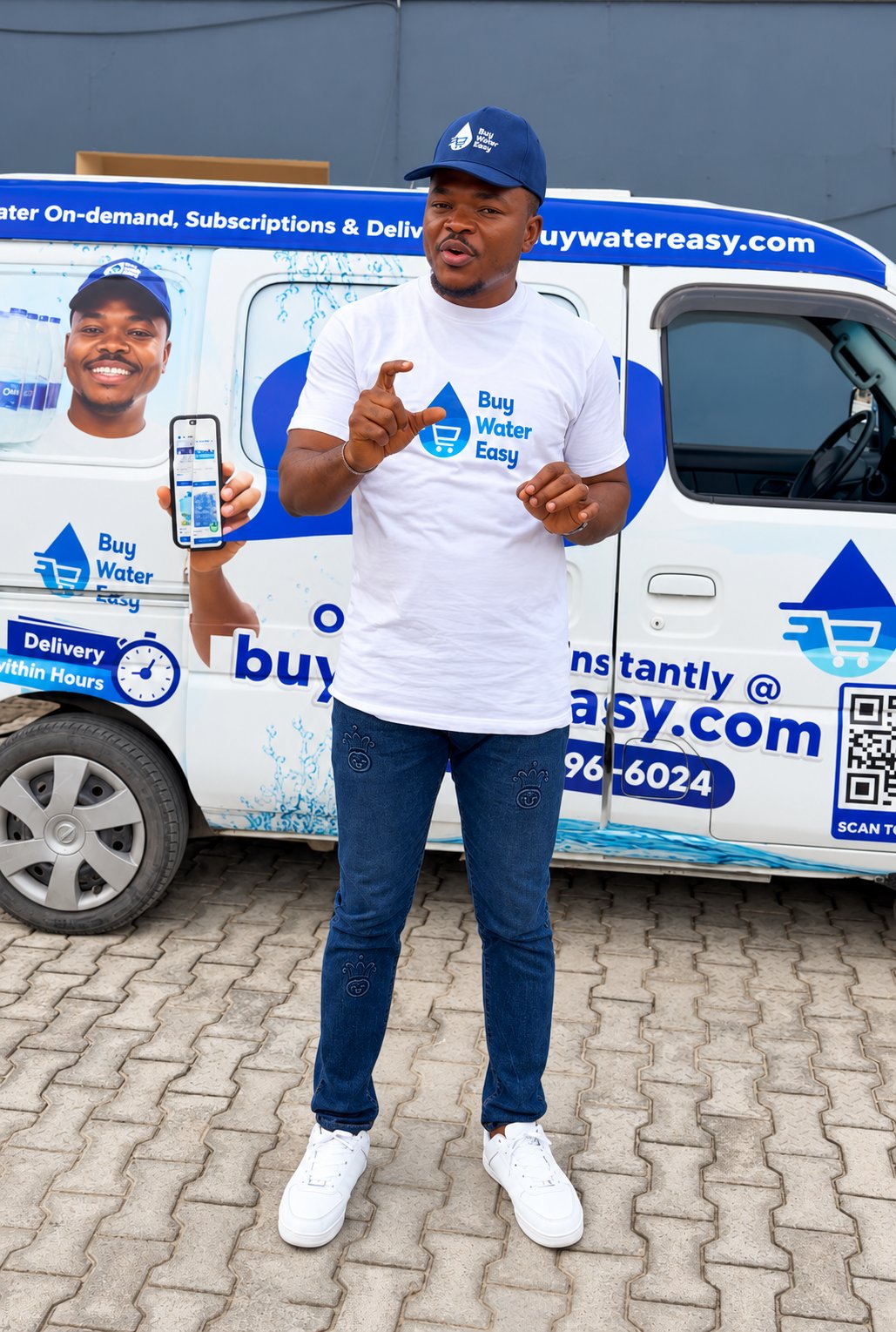 Buy Water Easy rider in a blue cap and branded t-shirt standing in front of the Buy Water Easy delivery van, showing buywatereasy.com and the delivery number